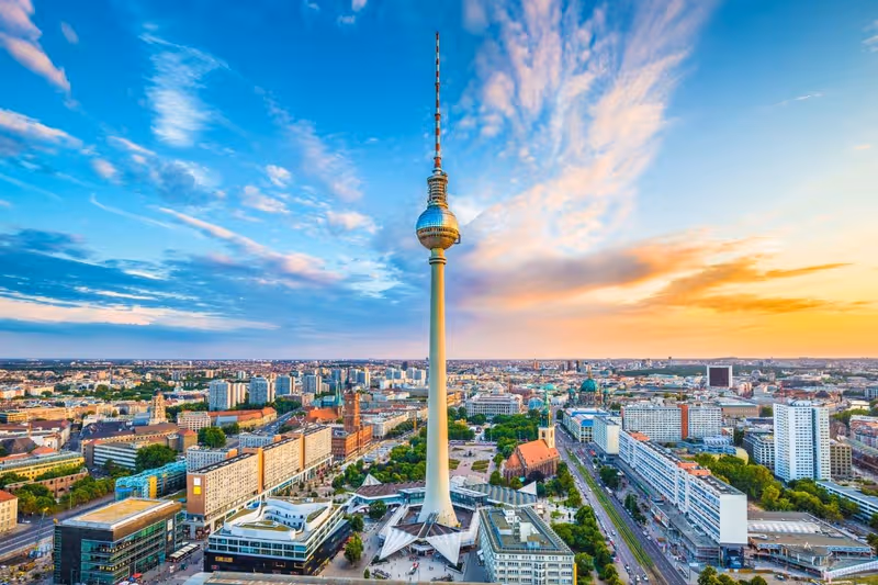 The Berlin TV Tower sphere reflecting the sun in the shape of a cross